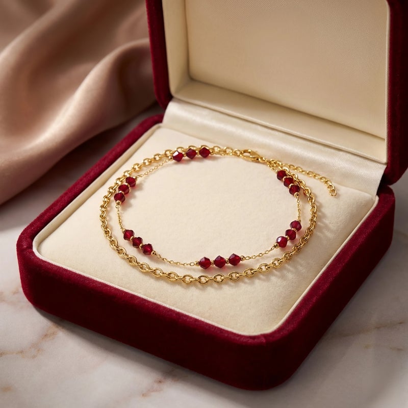 A luxurious gold anklet crafted from rust-resistant stainless steel, featuring a double-layered design adorned with colorful red beads. Combining elegance and vibrancy! Includes an adjustable clasp. - Image 4